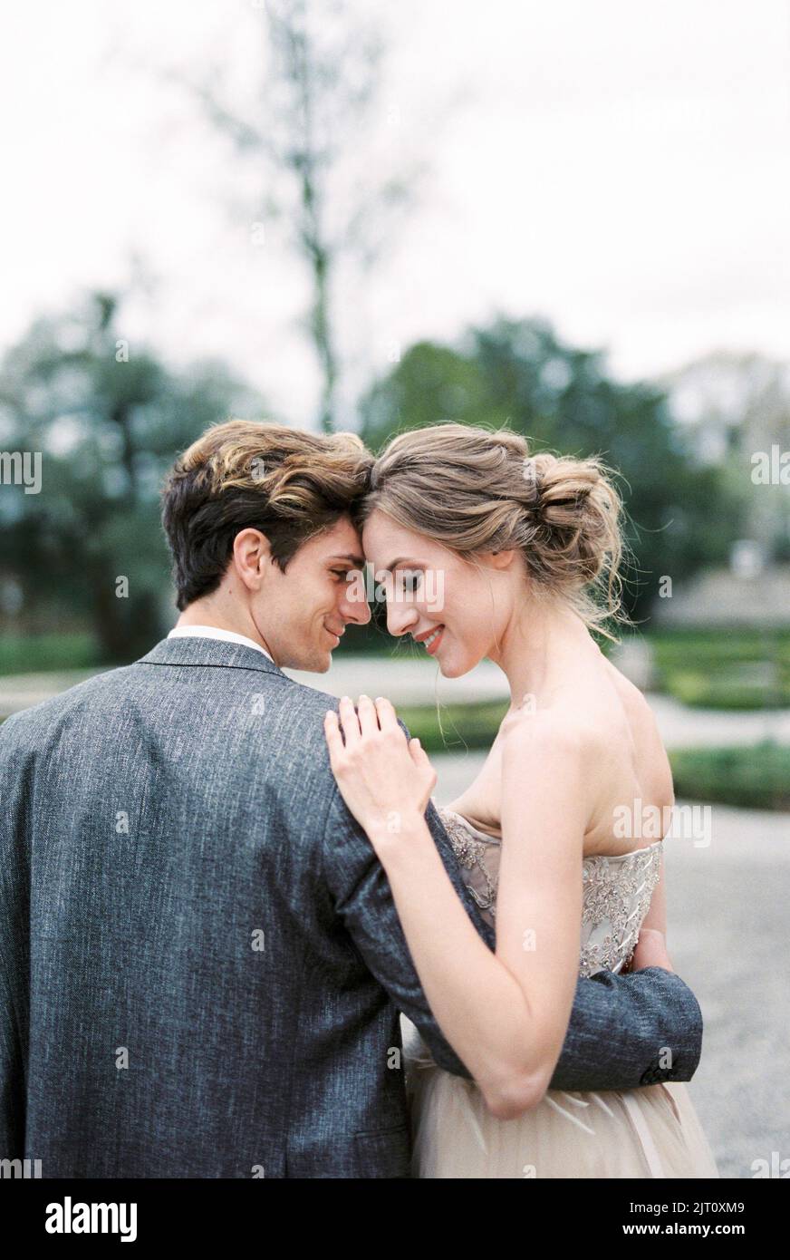 Bride and groom embrace in the park. Portrait Stock Photo - Alamy