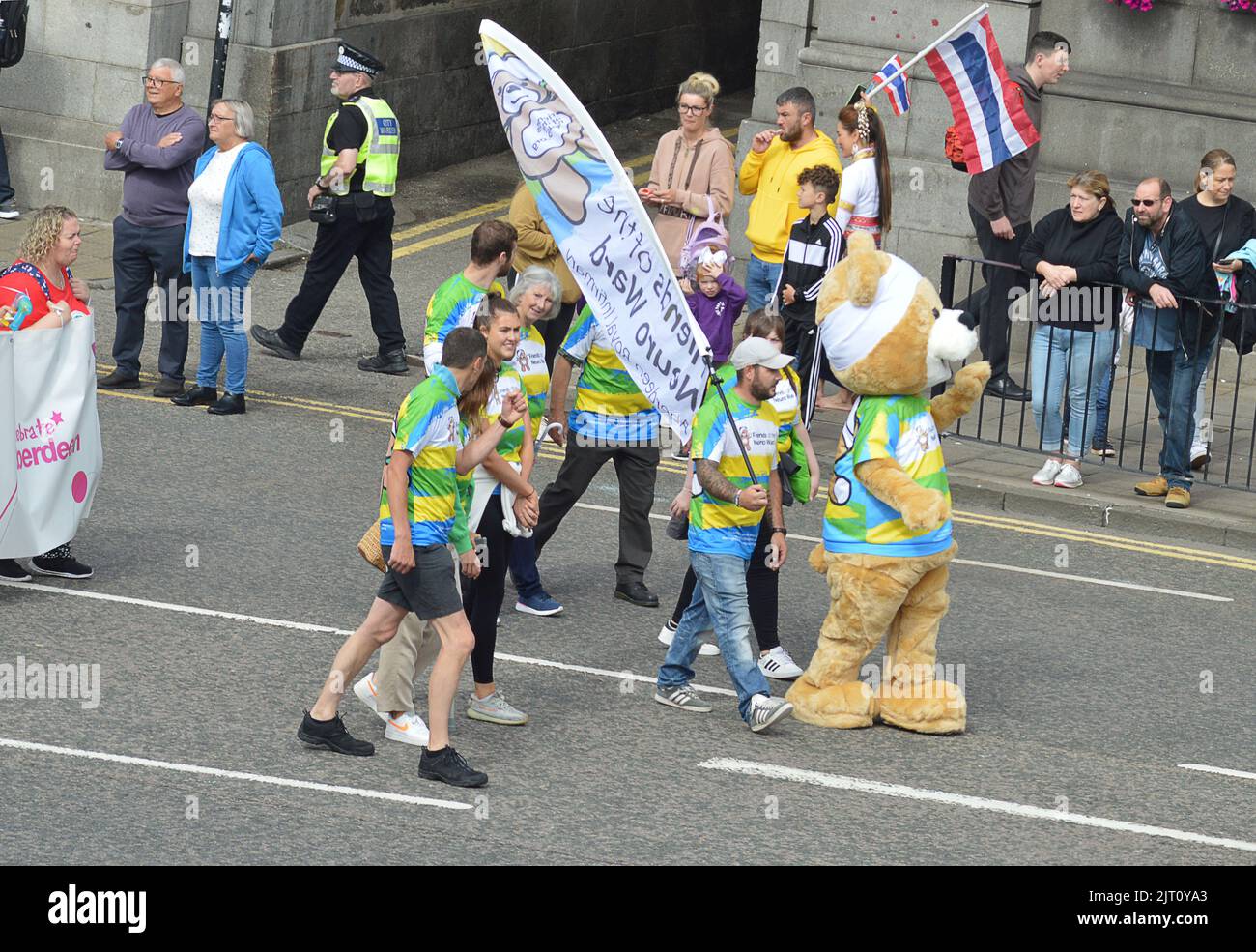 ABERDEEN, SCOTLAND - 27 AUGUST 2022: Members of the Friends of the Neuro War charity take par  in the Celebrate Aberdeen parade walk down Union Street. Stock Photo