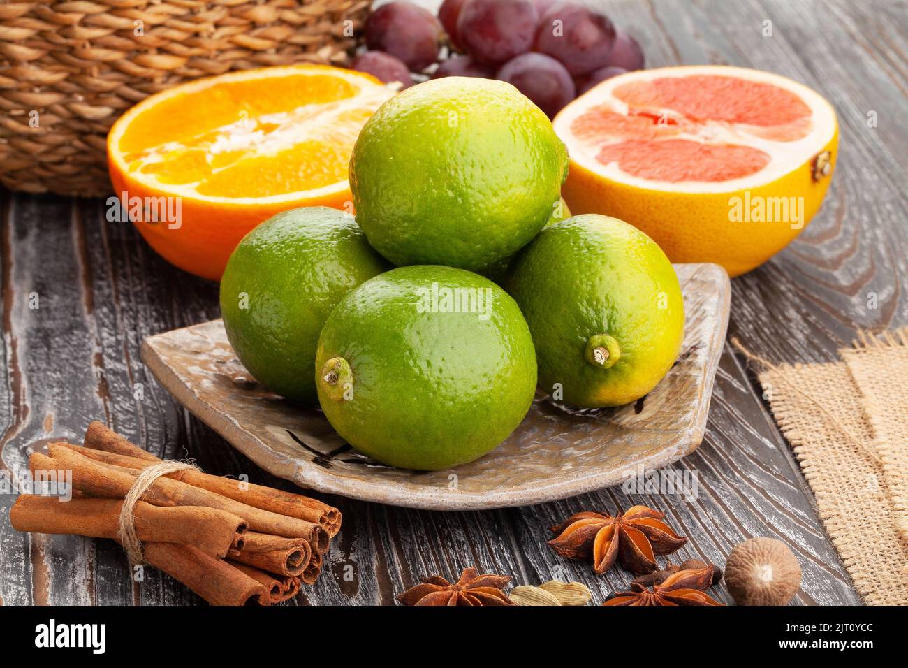 lime on a plate on wood background Stock Photo