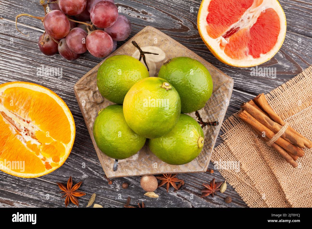 lime on a plate on wood background Stock Photo