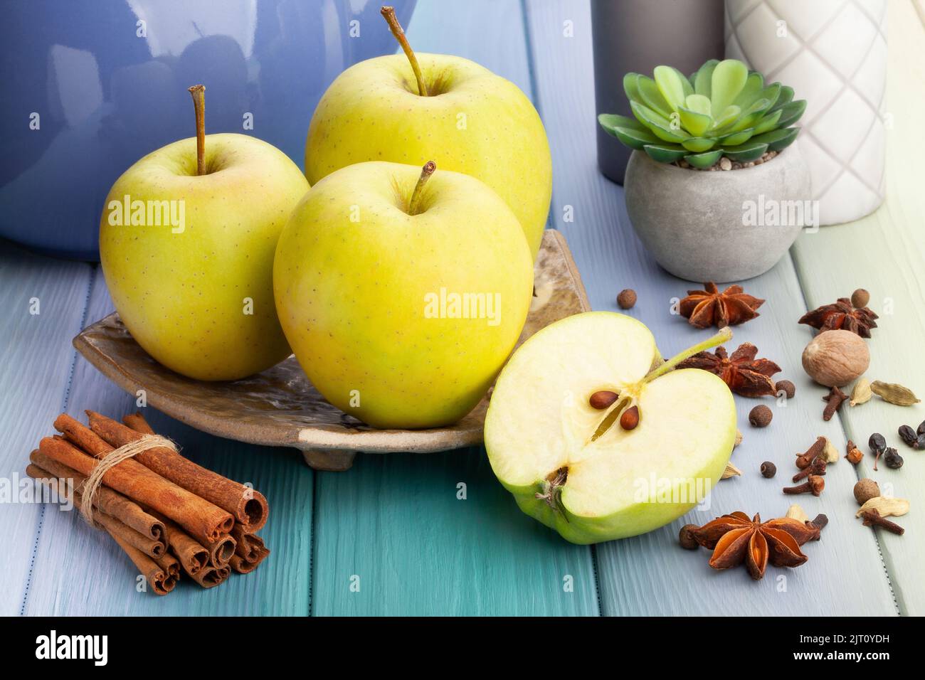 sliced yellow apples on wood background Stock Photo