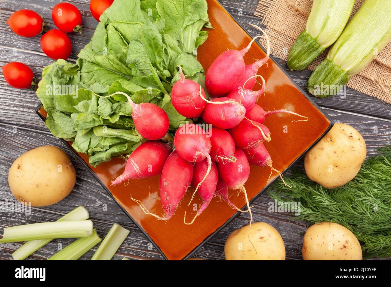 radish on a plate on wood background Stock Photo