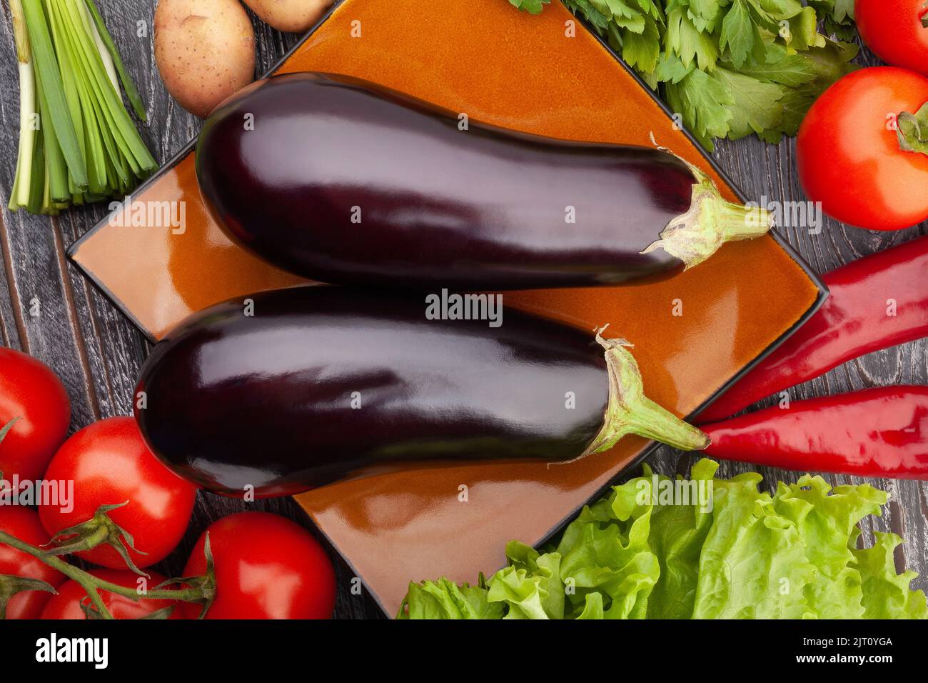 eggplant group on wood background Stock Photo