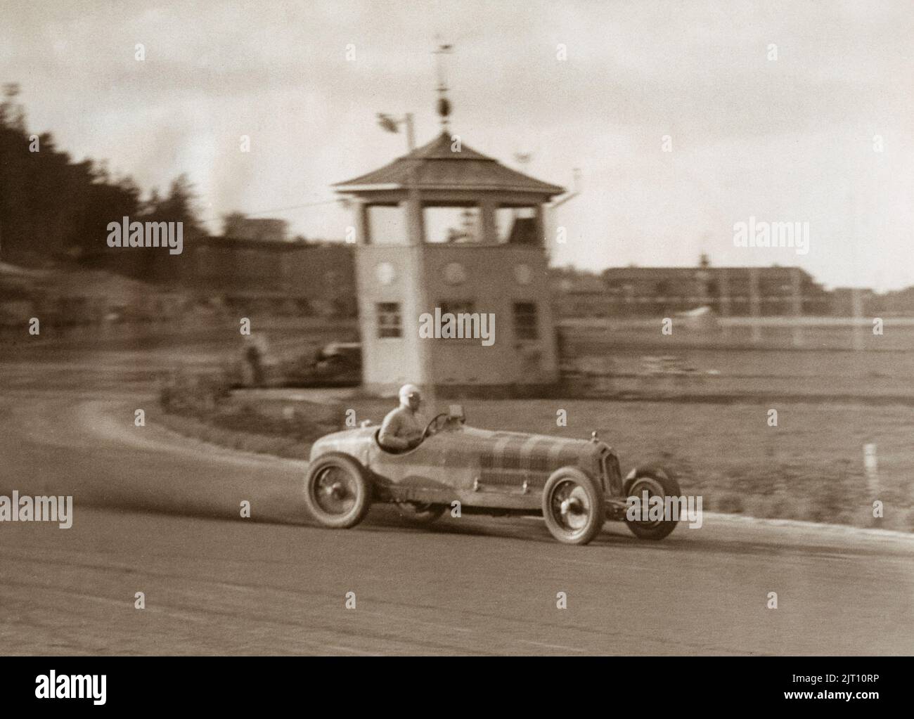 Racing car of the 1930s. The swedish racingdriver Per Victor Widengren in his Alfa Romeo Monza is seen taking the curve in full speed during the international racing event at Solvalla in Stockholm on october 15 1935. Stock Photo