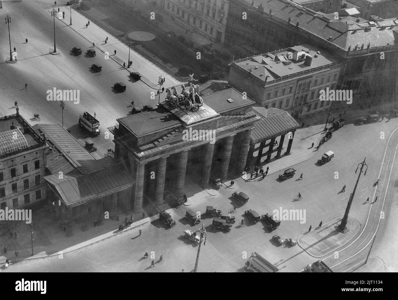 Berlin in the 1930s. An aerial view of Brandenburger gate on december 15 1933. An 18th- century neoclassical monument and one of the best-known landmarks of Germany located in the centre of Berlin. After World War II the Brandenburger gate was located in the soviet occupation zone and the Berlin wall was constructed directly next to it. The gaten is now considered a symbol of European unity and peace. The gate is the monumental entry to the boulevard Under den Linden. Stock Photo