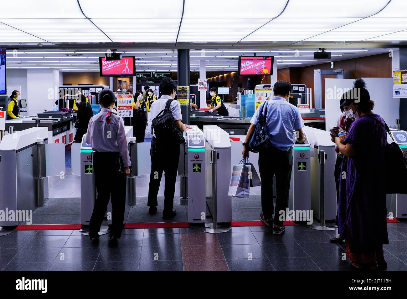 Employees of Japan Airlines (JAL) wearing face masks as a preventive
