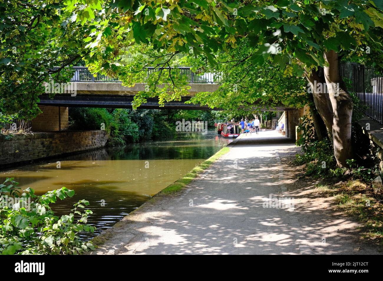 Saltaire, the Leeds and Liverpool canal and footbridge, Yorkshire Stock Photo