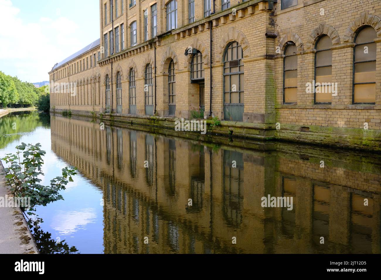 Saltaire, Salts mill, reflections , by the Leeds and Liverpool canal, Yorkshire Stock Photo