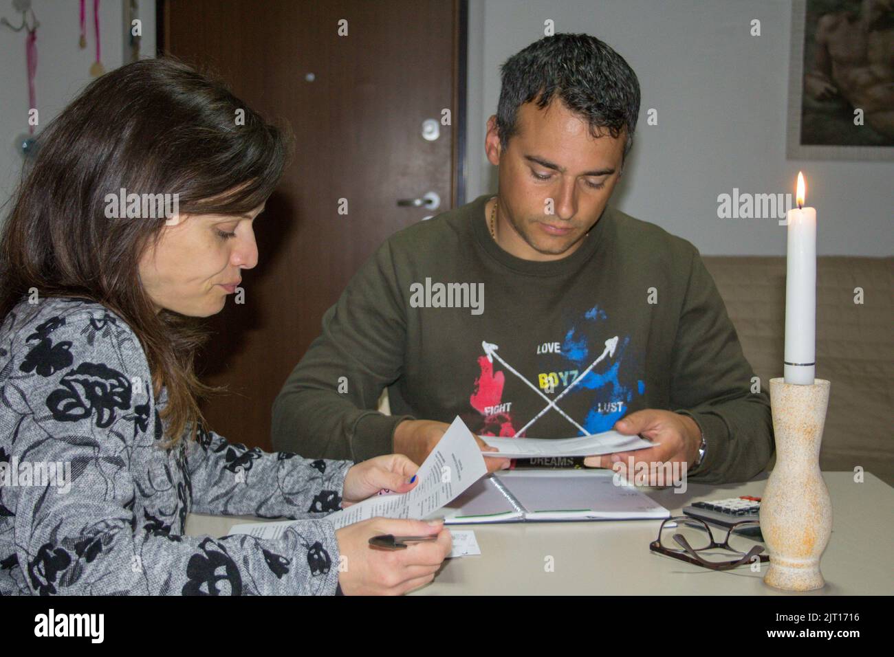 Image of a man and woman checking their electricity and gas bills. Economic problems due to the current global energy crisis Stock Photo