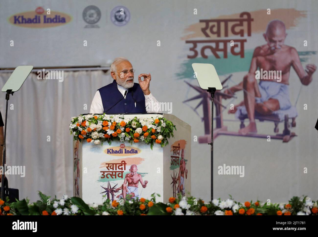 India's Prime Minister Narendra Modi speaks during an event where 7500 artisans spin cotton live at same place to promote hand woven cotton cloth as part of the celebrations commemorating 75 years of India's Independence, in Ahmedabad, India, August 27, 2022. REUTERS/Amit Dave Stock Photo