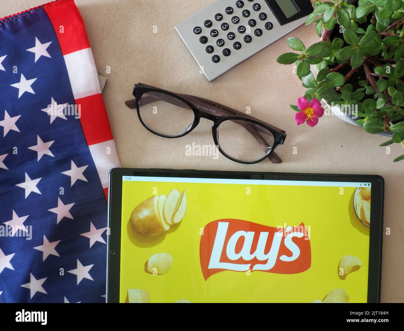 In this photo illustration,  Lay's potato chips logo seen displayed on a tablet Stock Photo