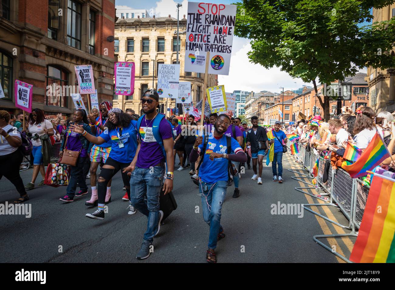 Manchester, UK. 27th Aug, 2022. The LGBTQIA  community come together with banners and flags during the Pride Parade. This year sees the parade come back at full capacity for the first time since 2019. Credit: Andy Barton/Alamy Live News Stock Photo