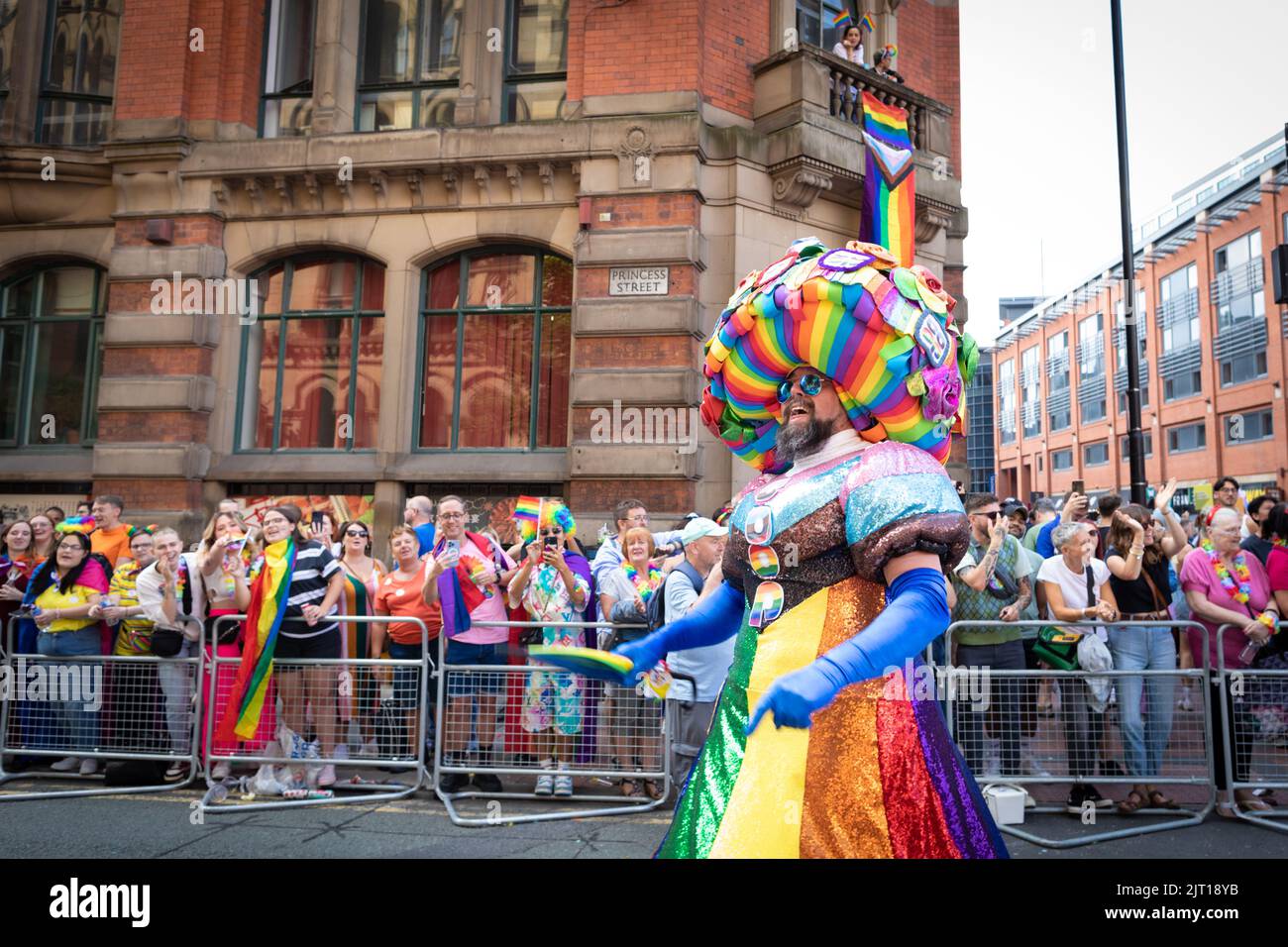 Manchester, UK. 27th Aug, 2022. A performer dressed in pride colours engages with the crowd during the Pride Parade. This year sees the parade come back at full capacity for the first time since 2019. Credit: Andy Barton/Alamy Live News Stock Photo