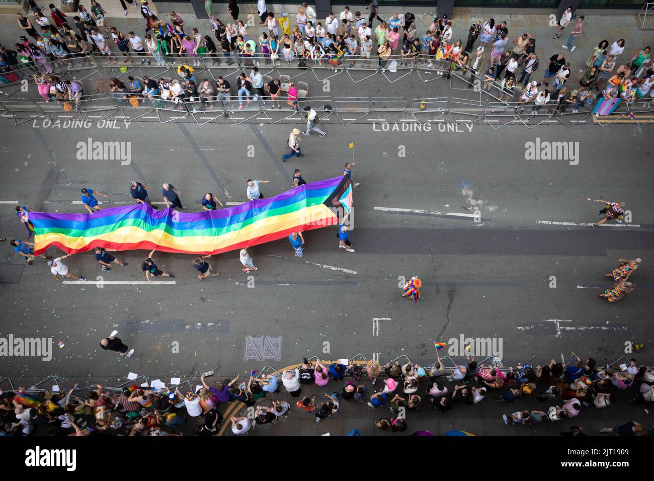 Manchester, UK. 27th Aug, 2022. Thousands of people come out to take part in and watch the Pride Parade. This year sees the parade come back at full capacity for the first time since 2019. Credit: Andy Barton/Alamy Live News Stock Photo