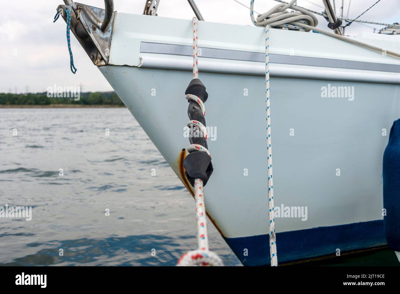 Yacht moored. mooring line with rubber compensator snubber Stock Photo