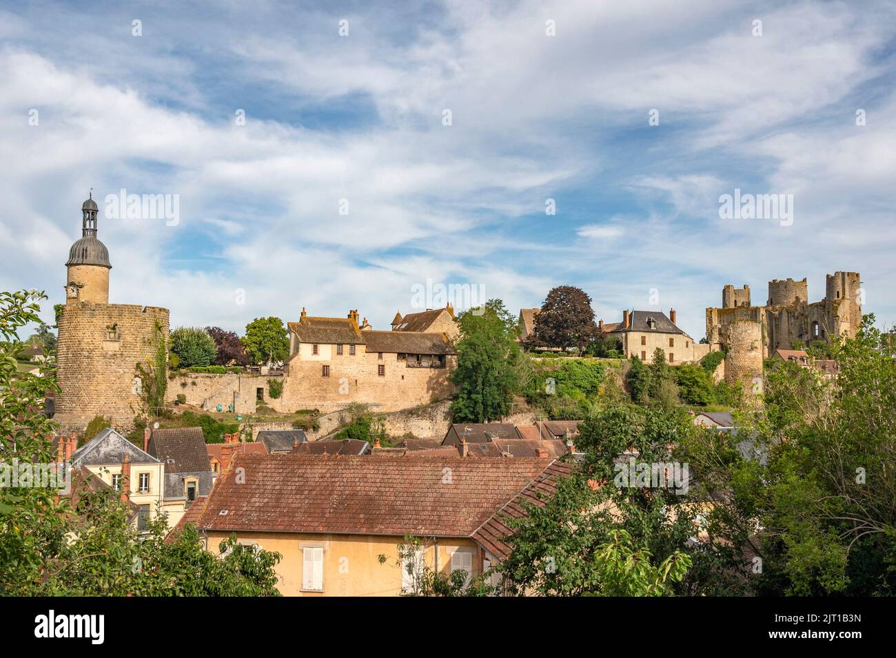 Once an impressive fortress with 15 towers, only 3 towers survived and today dominate the skyline of Bourbon-l'Archambault in Allier, France Stock Photo