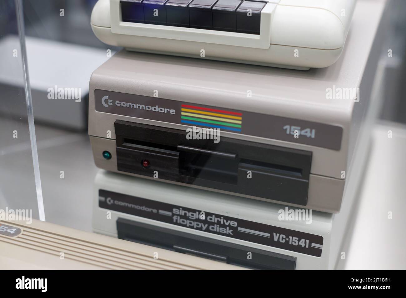 Oslo, Norway. May 01, 2022 Old computer Commodore 154 and hand insert floppy inside. Oslo Museum of Technology. Stock Photo