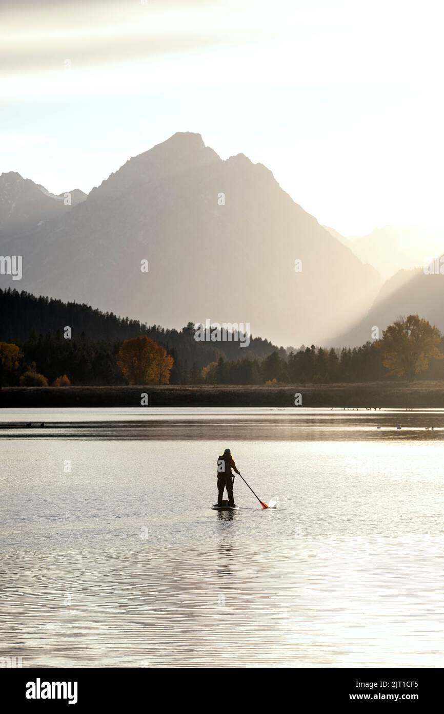 WY04996-00.....WYOMING - Paddle boarder on the Snake River at the Ox Bow in Grand Teton National Park. Stock Photo