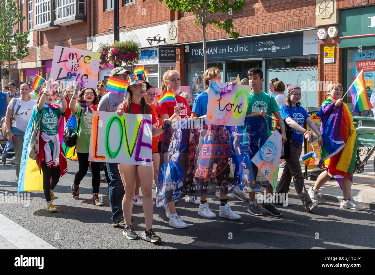 Pride in Surrey parade in Camberley Town on 27th August 2022, Surrey, England, UK. People in colourful costumes march for LGBTQ+ rights. Stock Photo