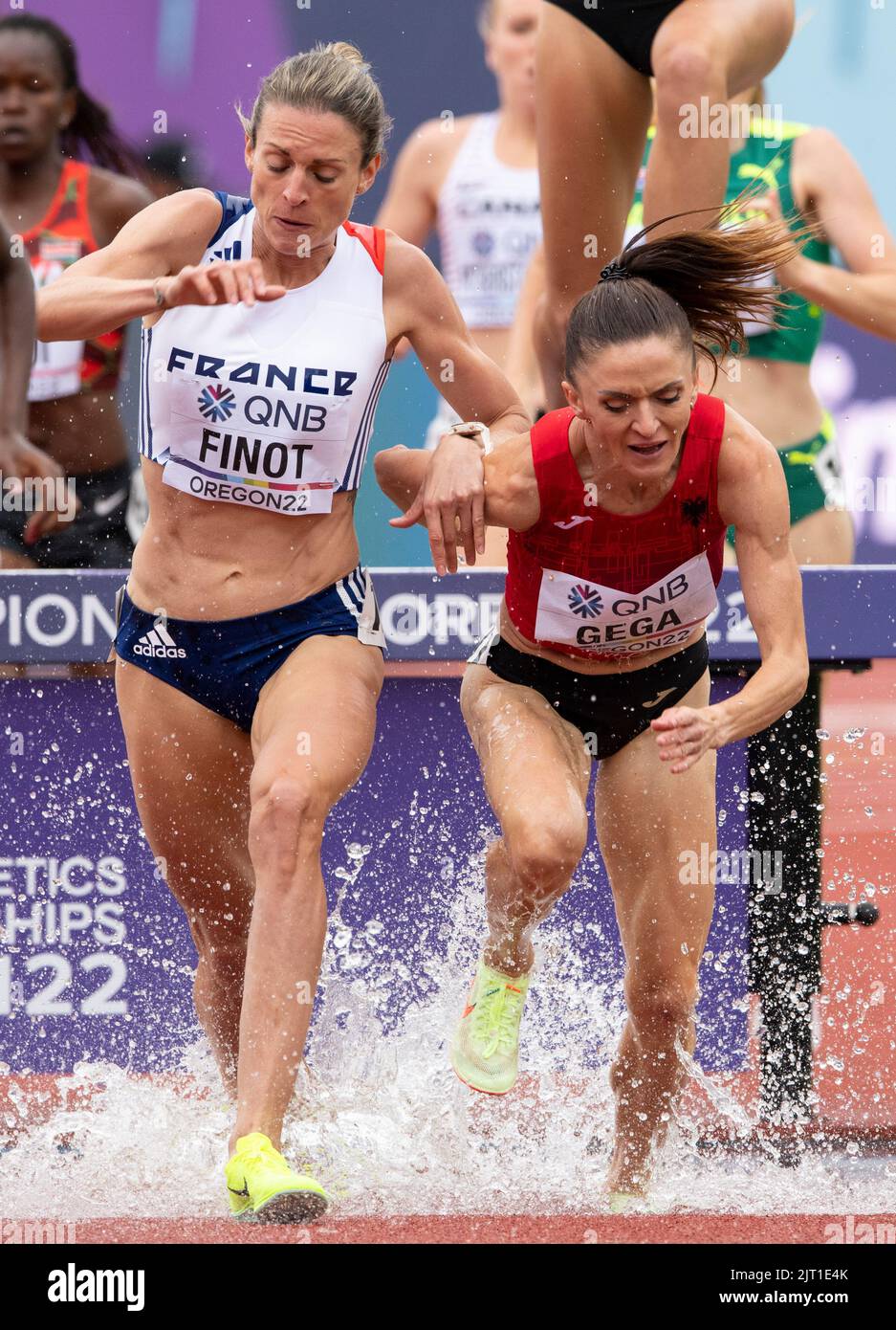 Alice Finot of France and Luiza Gega of Albania competing in the women’s 3000m steeplechase heats at the World Athletics Championships, Hayward Field, Stock Photo