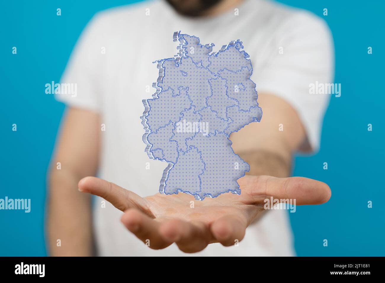 A 3d rendering illustration of a floating map of Germany in the man's hands Stock Photo