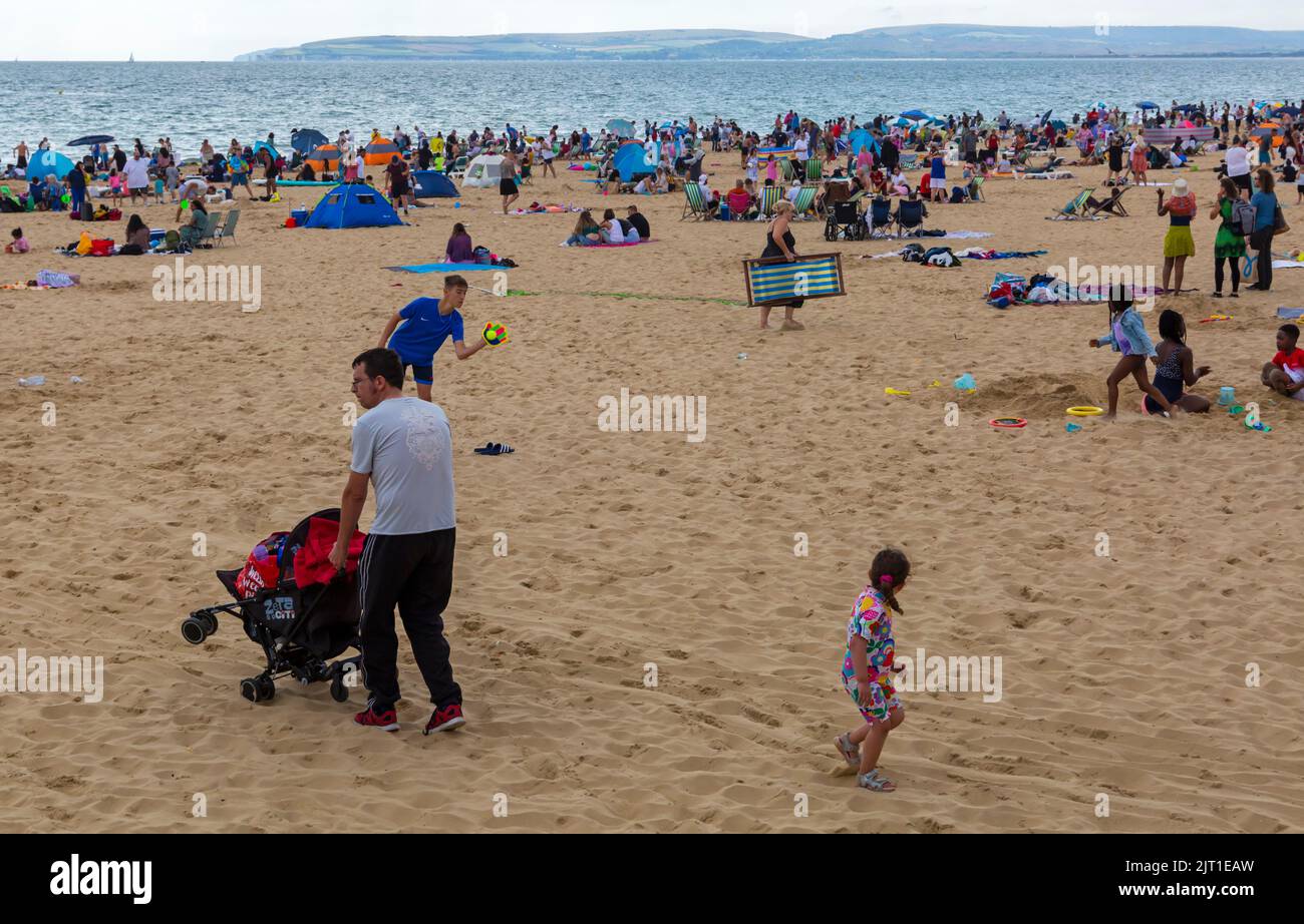 Bournemouth, Dorset UK. 27th August 2022. UK weather: Crowds flock to Bournemouth beach on a warm sunny day to enjoy the sunshine at the seaside for the start of the long Bank Holiday weekend. Credit: Carolyn Jenkins/Alamy Live News Stock Photo