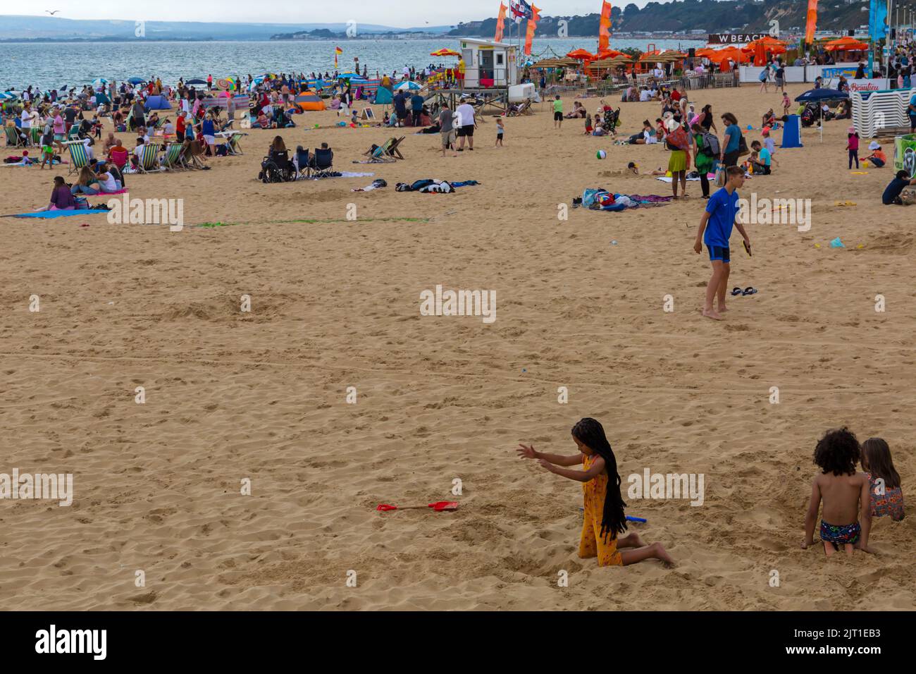Bournemouth, Dorset UK. 27th August 2022. UK weather: Crowds flock to Bournemouth beach on a warm sunny day to enjoy the sunshine at the seaside for the start of the long Bank Holiday weekend. Credit: Carolyn Jenkins/Alamy Live News Stock Photo