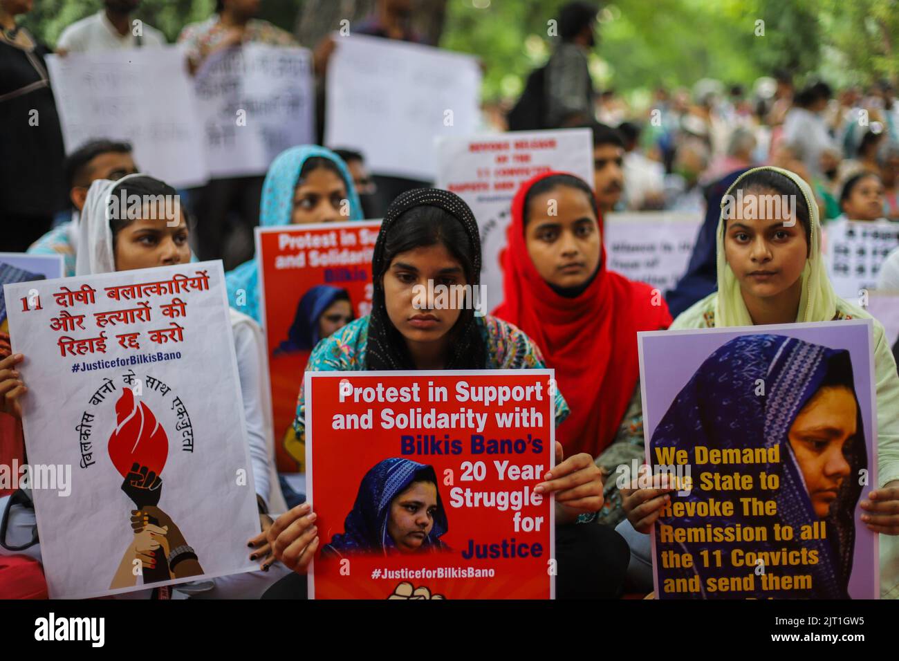 New Delhi, India. 27th Aug, 2022. Demonstrators hold placards during a protest against the release of a group of convicts who had gang raped Bilkis Bano during the 2002 communal riots in Gujarat from jail following a recommendation by a Gujarat state government panel in New Delhi. Bano, who was gang-raped while 14 others were brutally murdered in one of post-independent India's worst religious riots, said that she was 'numb' after learning about the early release of the convicts. Credit: SOPA Images Limited/Alamy Live News Stock Photo