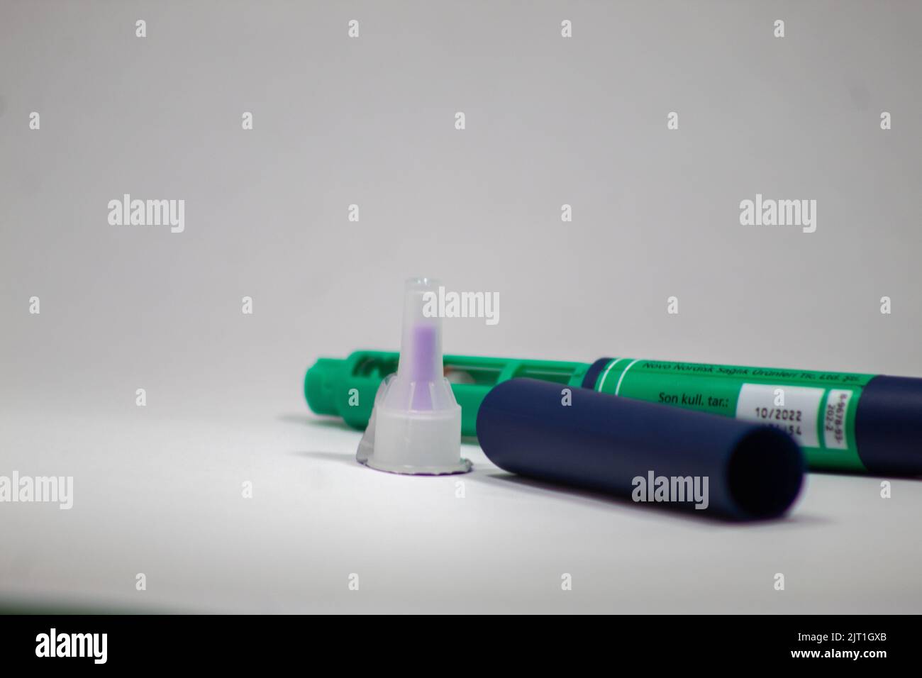 Bursa, Turkey August 2022 Blue and green color insulin pen on