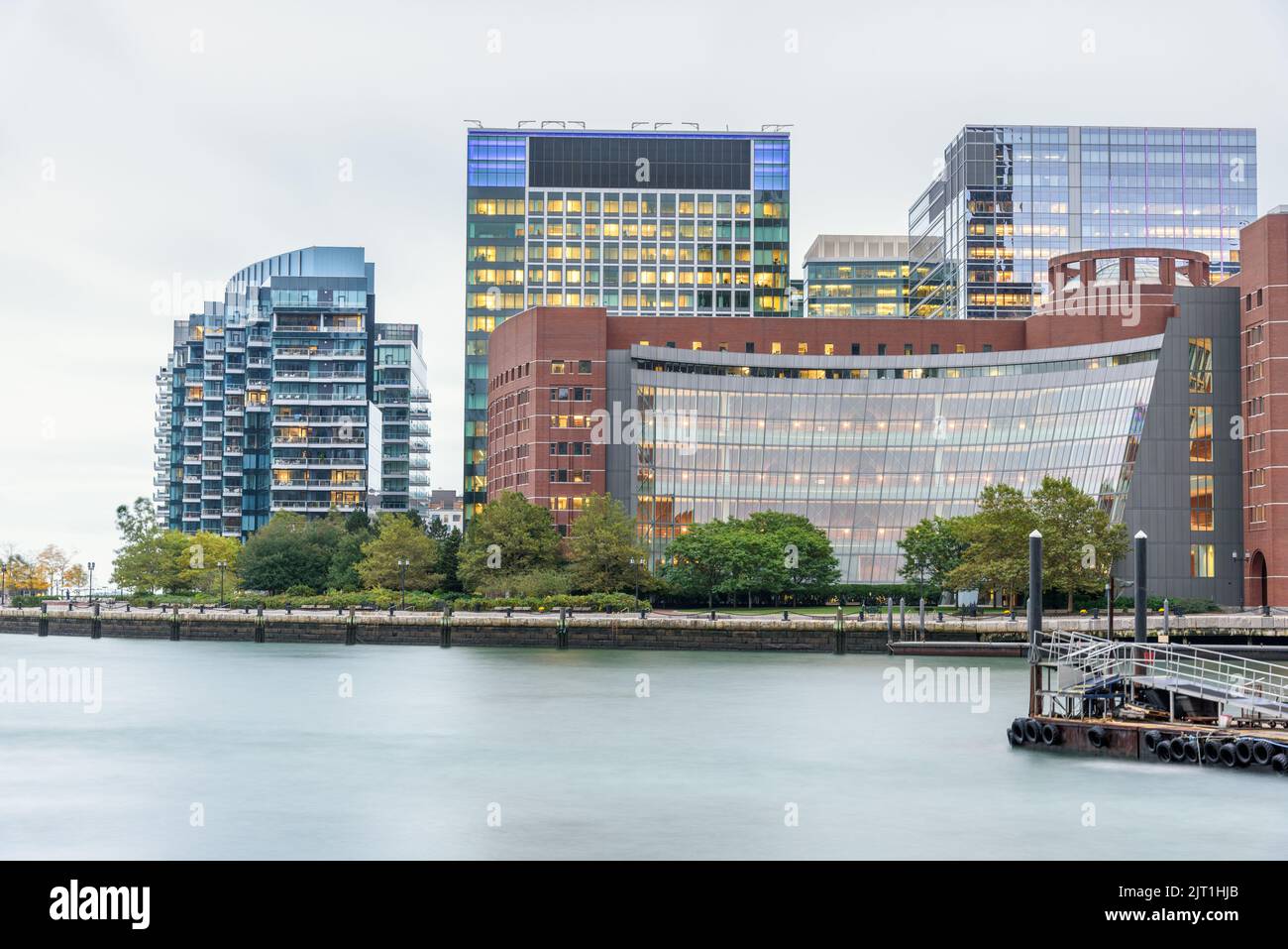 Waterfront apartment buildings and blocks of offices on a cloudy autumn evening. Boston, MA, USA. Stock Photo