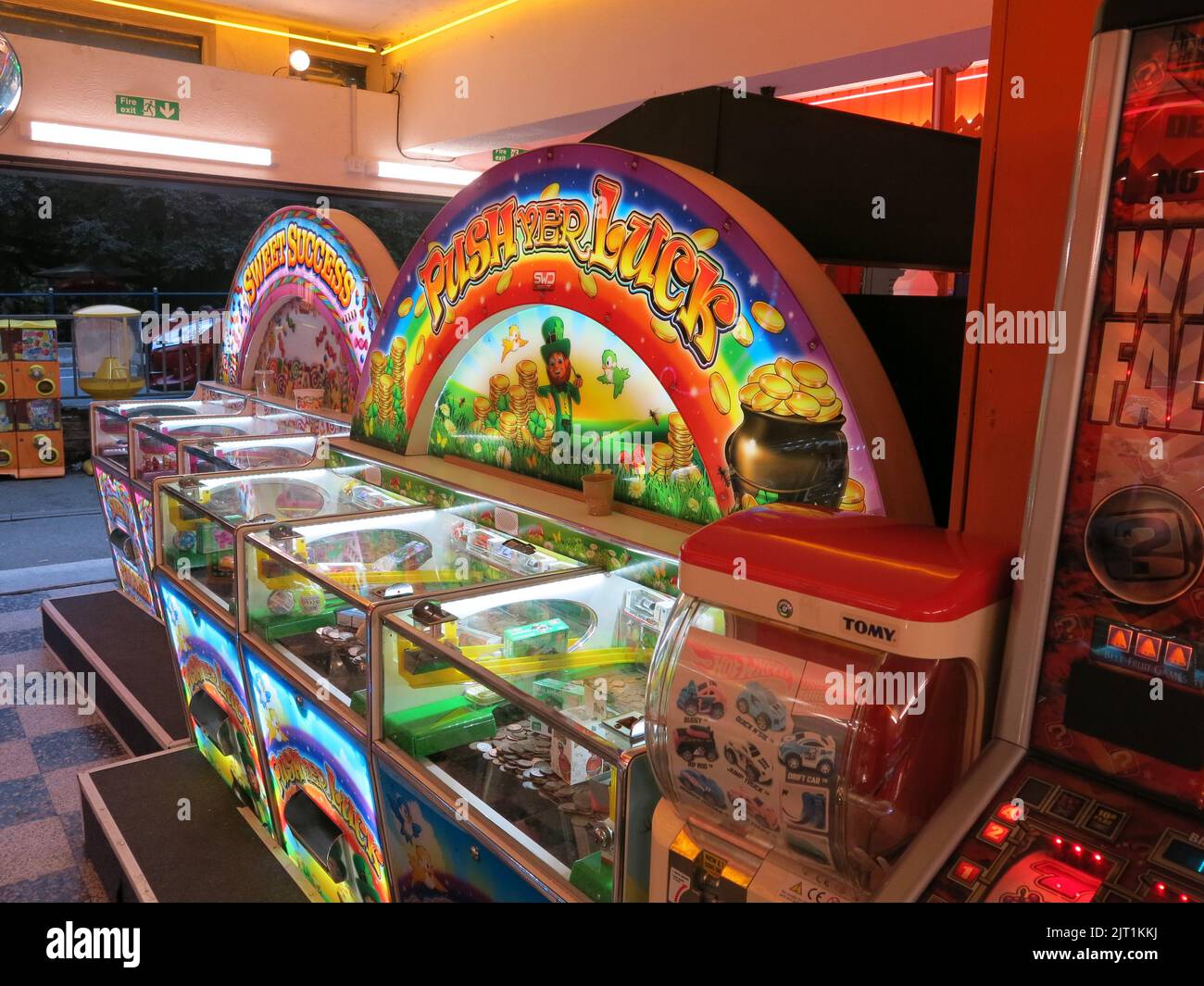 The traditional English seaside holiday: one of the games in an amusement arcade to 'Push Yer Luck' at tipping the coins off a tray. Stock Photo