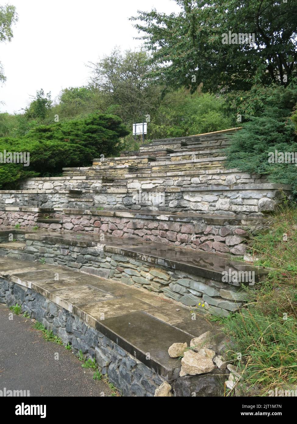 The Geosteps at the National Stone Centre form an auditorium and the ten risers demonstrate rock ages in the geological timeline from Pre-Cambrian on. Stock Photo