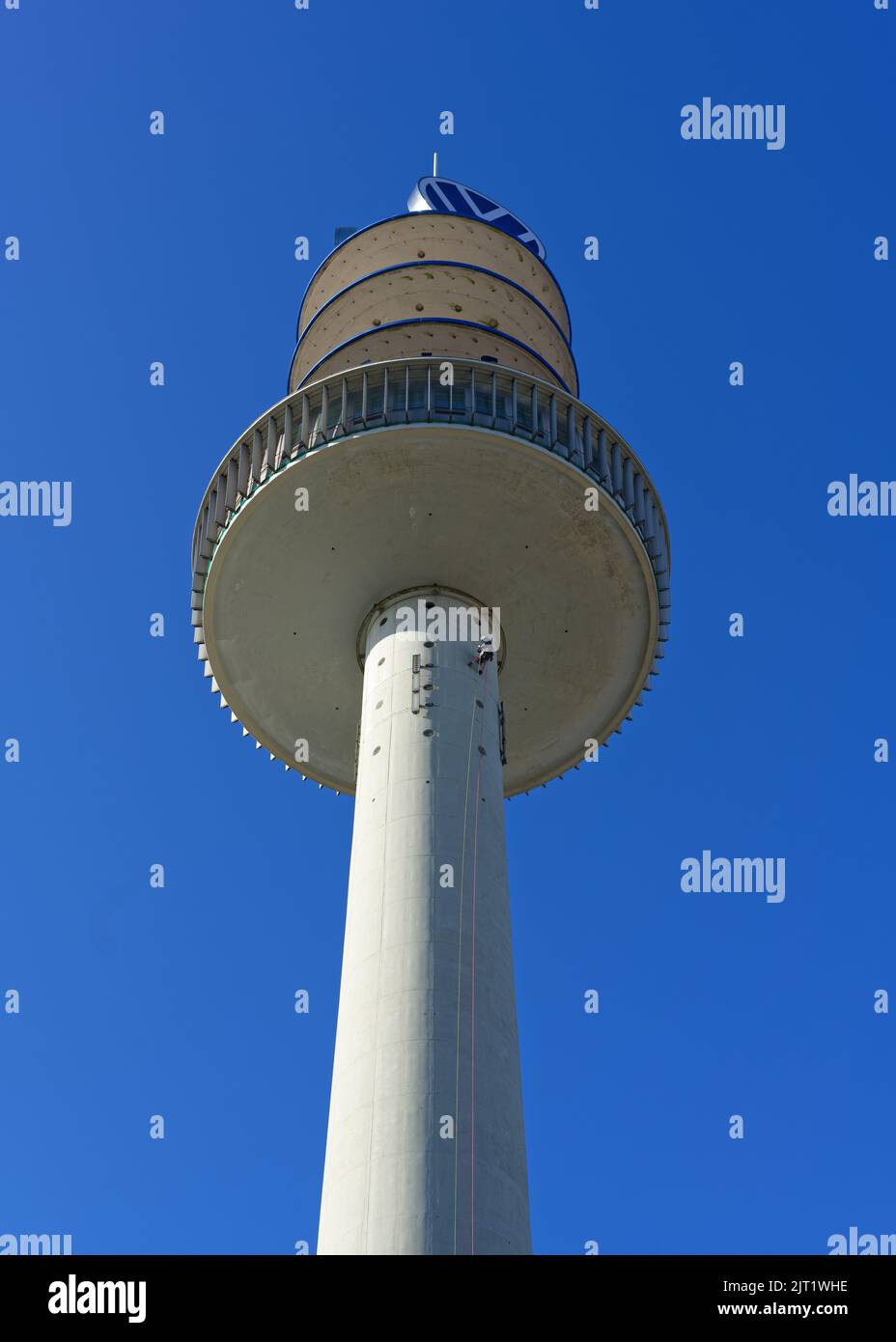 The 'Older TV Tower' with an industrial climber at work Stock Photo