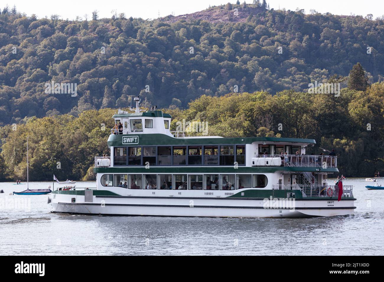 Lake Windermere Cumbria 27th August 2022 .UK Weather Vessels of all sizes & age busy with tourist make the most of the Bank Holiday weekend weather.  The M.V. Swift  .built during lockdown, is 34.4 metres long and uses 2 x Volvo Penta engines to power an electrical propulsion system Credit: Gordon Shoosmith/Alamy Live News Stock Photo