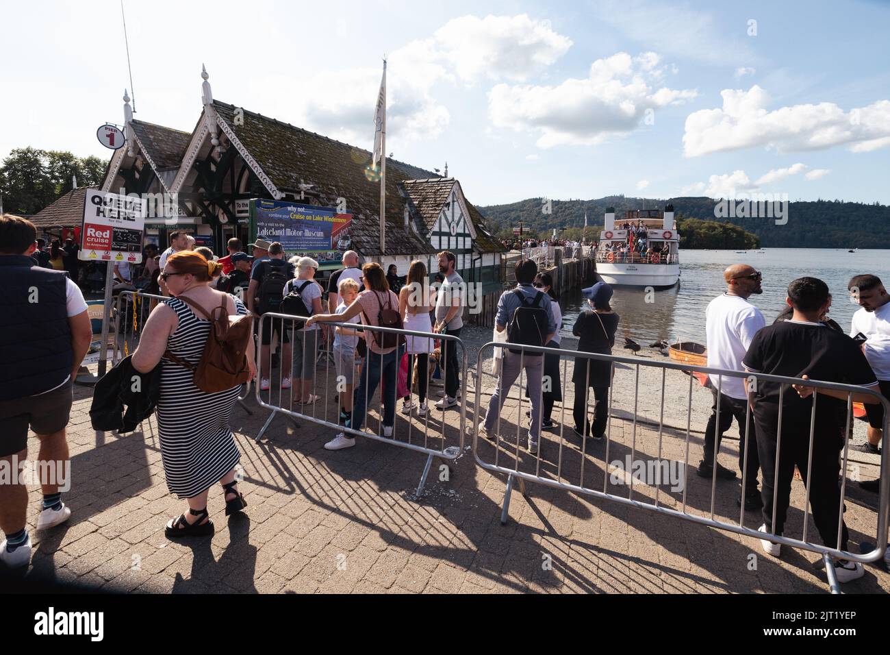 Lake Windermere Cumbria 27th August 2022 .UK Weather Vessels of all sizes & age busy with tourist make the most of the Bank Holiday weekend weather Queue here for 'steamers'. built 1938 Credit: Gordon Shoosmith/Alamy Live News Stock Photo
