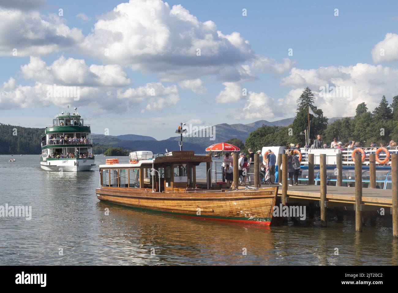Lake Windermere Cumbria 27th August 2022 .UK Weather Vessels of all sizes & age busy with tourist make the most of the Bank Holiday weekend weather. The Queen of The Lake wooden vessel built 1949 Credit: Gordon Shoosmith/Alamy Live News Stock Photo