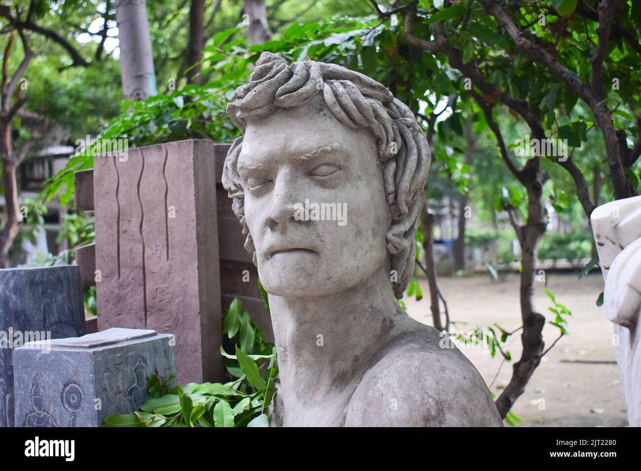 isolated Head sculptor in a garden Stock Photo Alamy