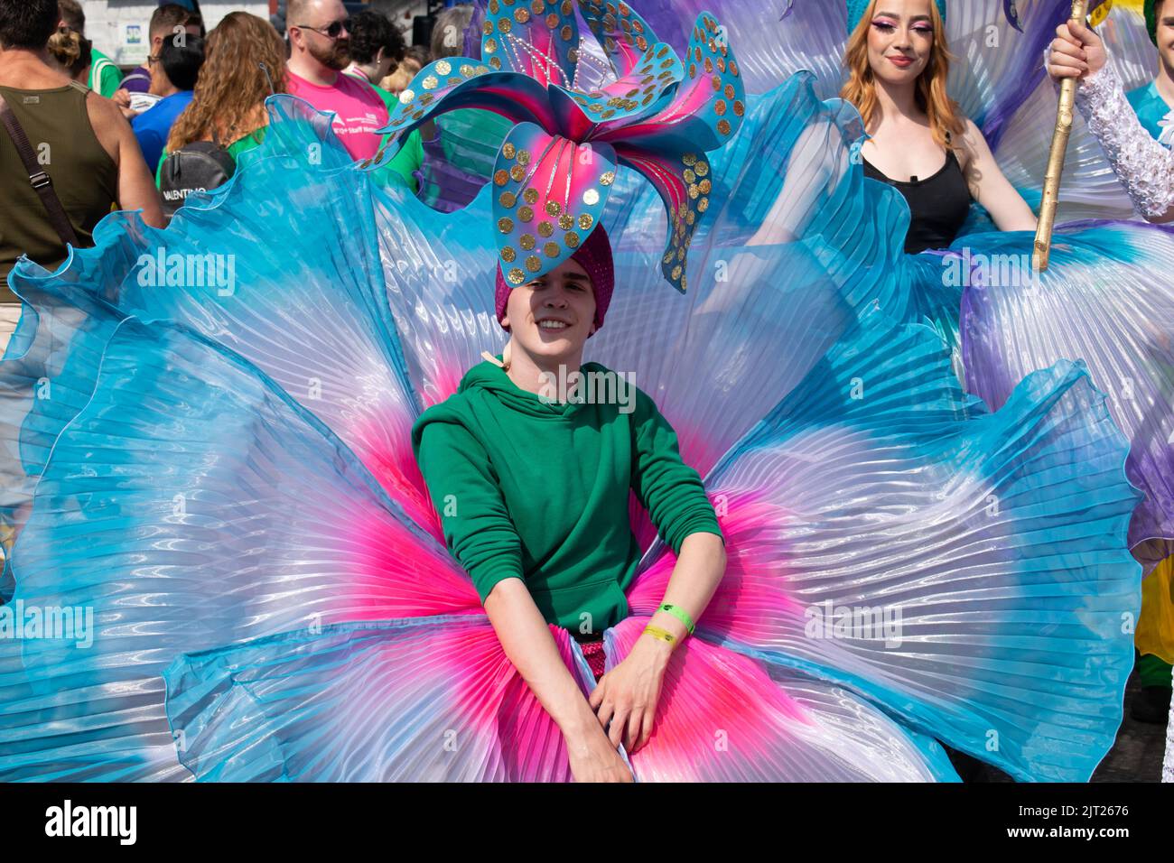 Manchester Pride parade. Participants in blue flower costume.  Theme March for Peace. Stock Photo