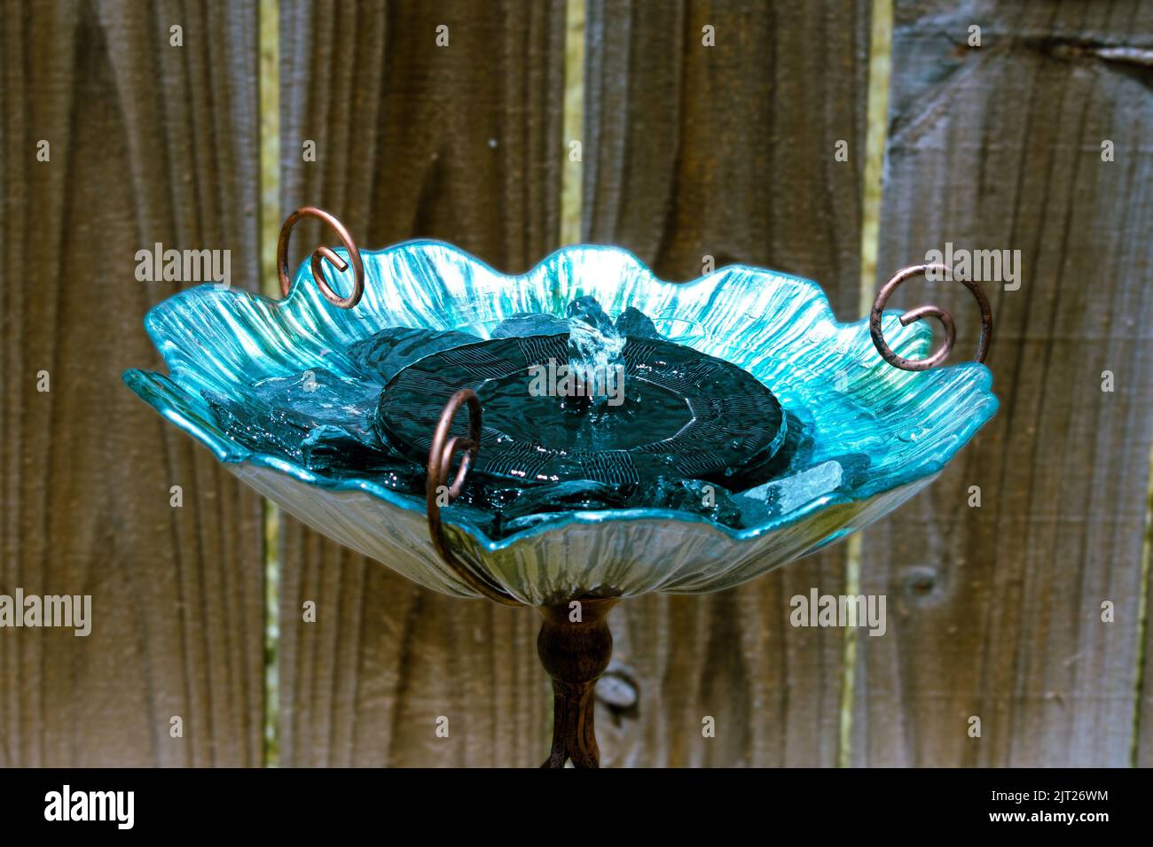 Blue & Green glass birdbath with solar powered fountain for garden Stock Photo