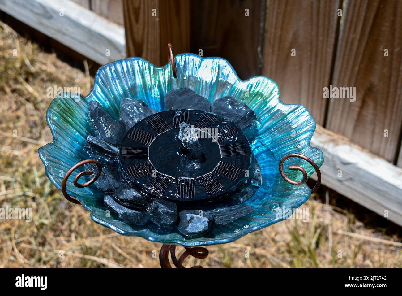 Glass blue and green birdbath with solar powered fountain for garden Stock Photo Alamy