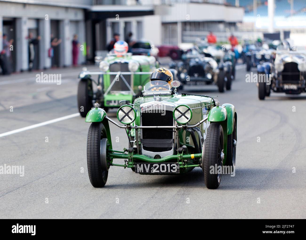 Silverstone Circuit,  Silverstrone, Nr, Towcester, 27th August,  2022.  Competitors making their way out to trhe track for the start of the MRL Pre-War Sports Car 'BRDC 500' Race. John Gaffen/Alamy Live News Stock Photo