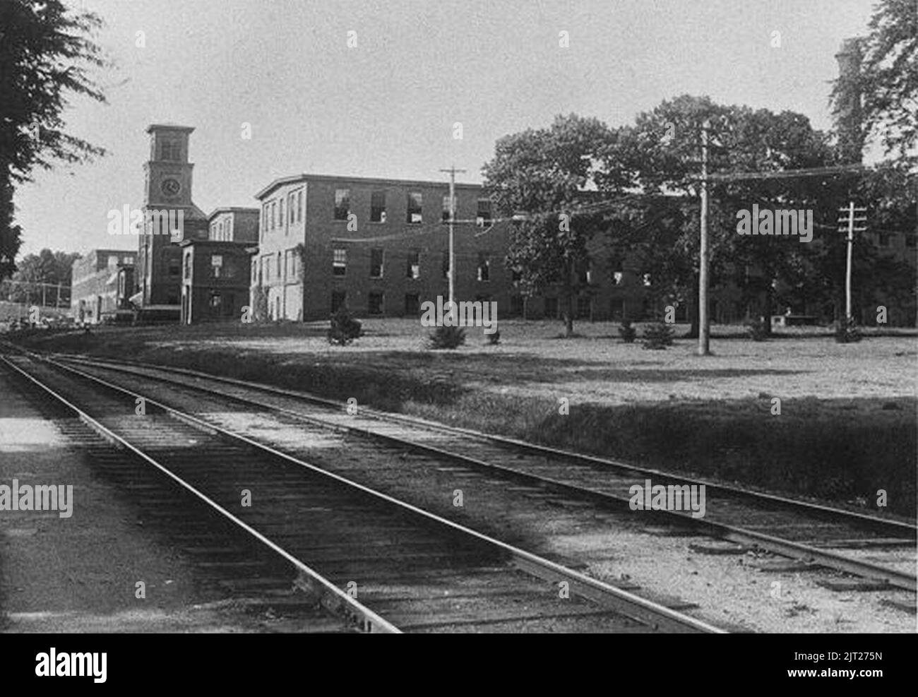 Tracks of the South Manchester Railroad near the Clock Tower Mill between Hartford Road and Forest Street in Manchester, Connecticut, around 1900. Stock Photo