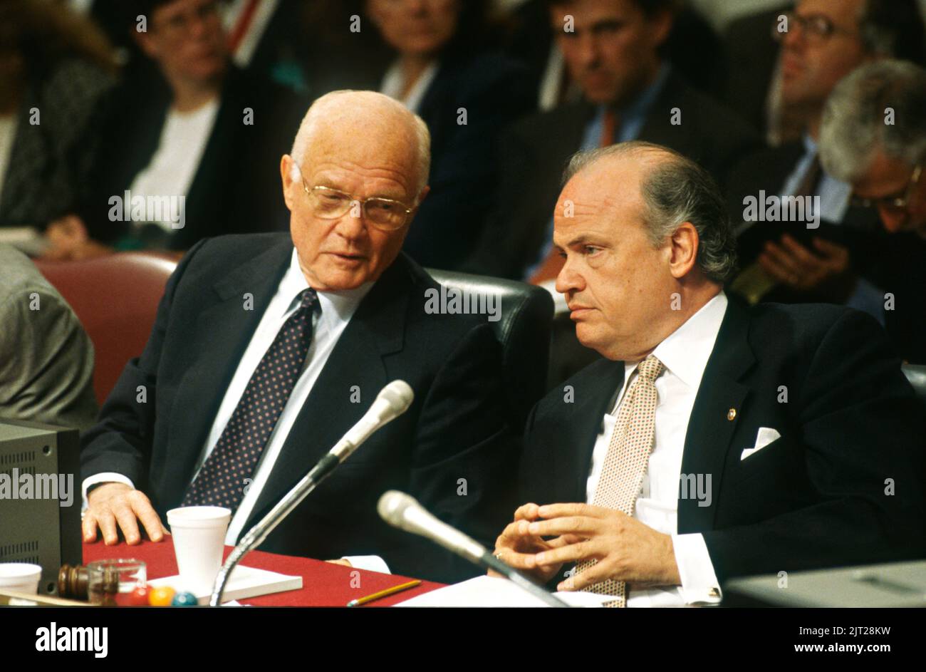 Senator Fred Thompson of Tennessee, chairman of the Senate Governmental Affairs Committee, right, and Ranking Minority member Senator John Glenn of Ohio, confer during hearing into allegations of illegal and improper fundraising practices by the Democrats during the 1996 presidential election, September 7, 1997 in Washington, D.C. Stock Photo