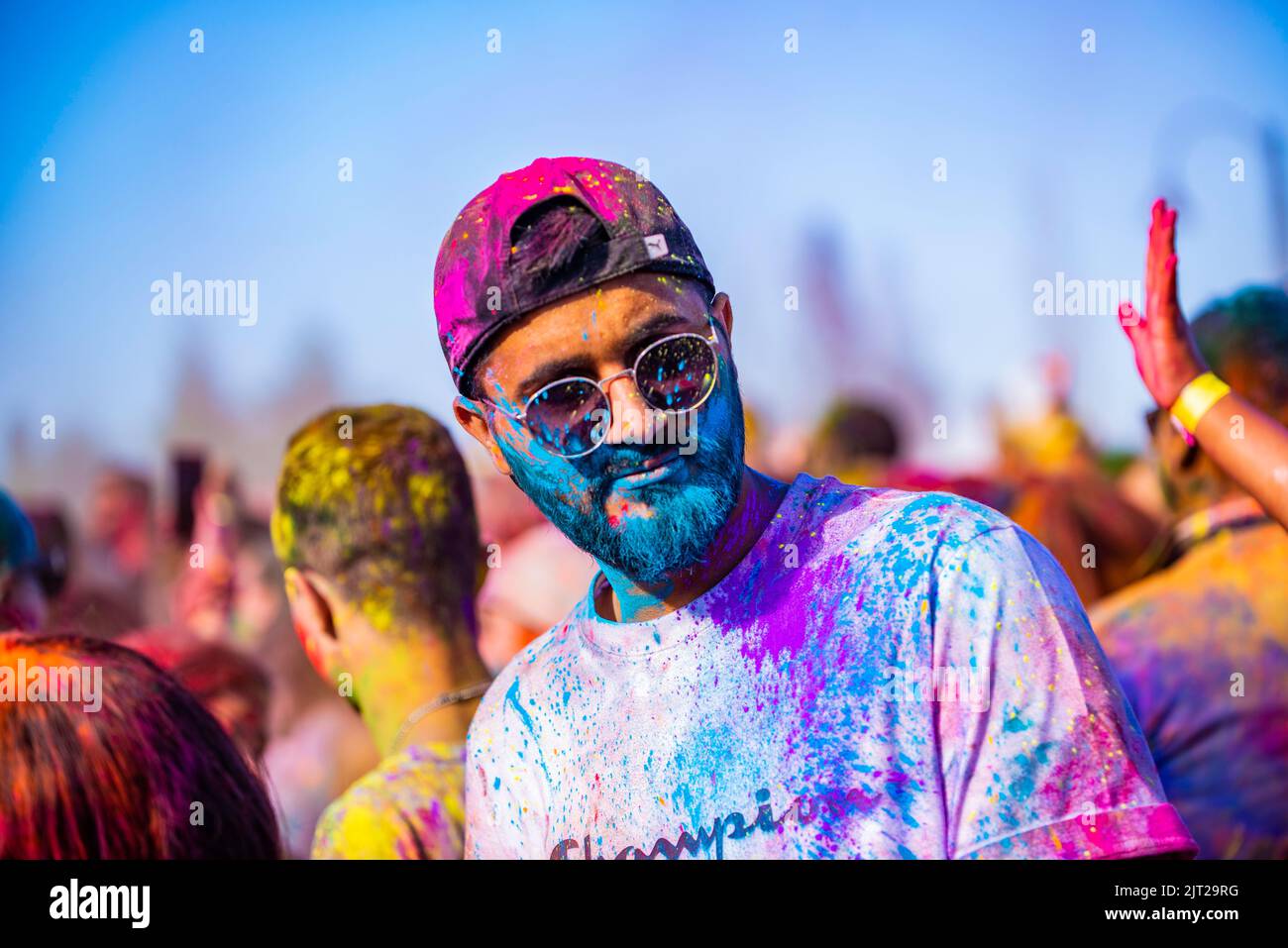 Montreal,Canada - Auguest 1' 20éé: Happy people celebrate HOLI Festival dancing and throwing color powders in Horloge Park in Montreal Stock Photo