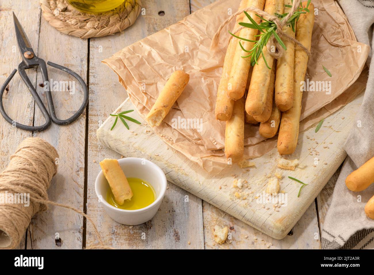 Traditional italian breadsticks grissini with rosemary, olive oil and