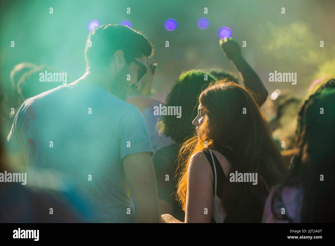 Montreal,Canada - Auguest 1' 20éé: Happy people celebrate HOLI Festival dancing and throwing color powders in Horloge Park in Montreal Stock Photo