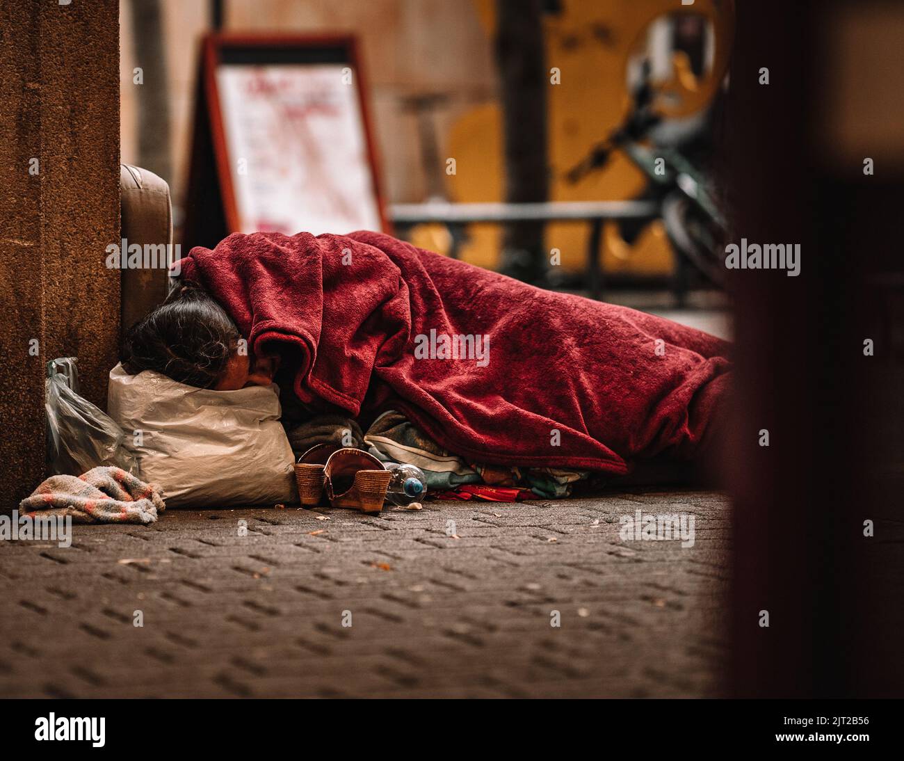 A homeless sleeping on the street Stock Photo Alamy