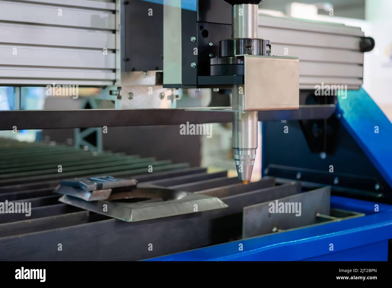 Plasma cutting machine working with sheet metal at metalworking