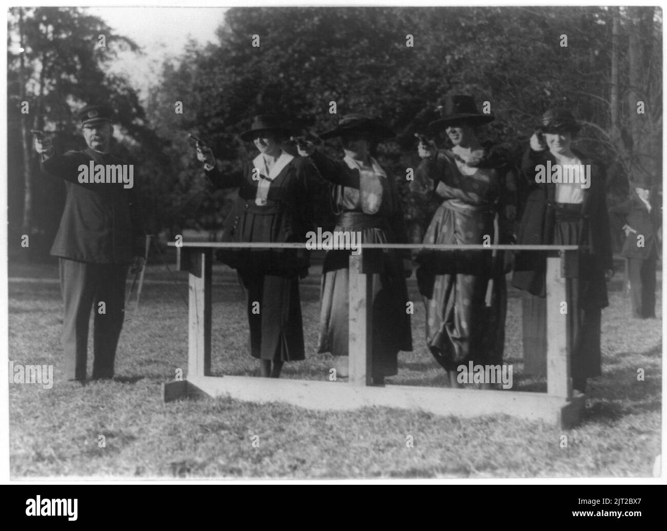 Training a policewoman-target practice under the direction of Inspector ...