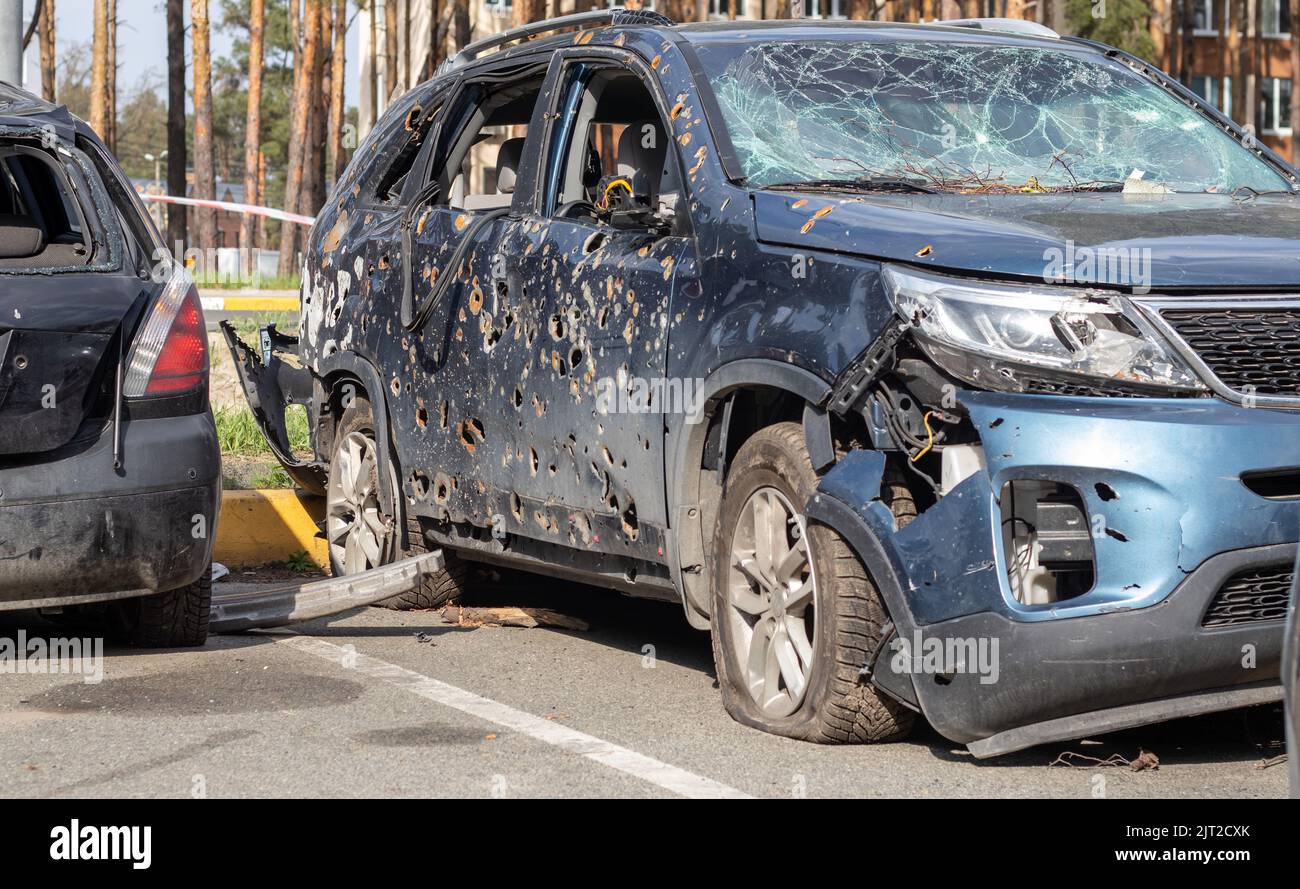 Car riddled with bullets. War of Russia against Ukraine. A car of ...